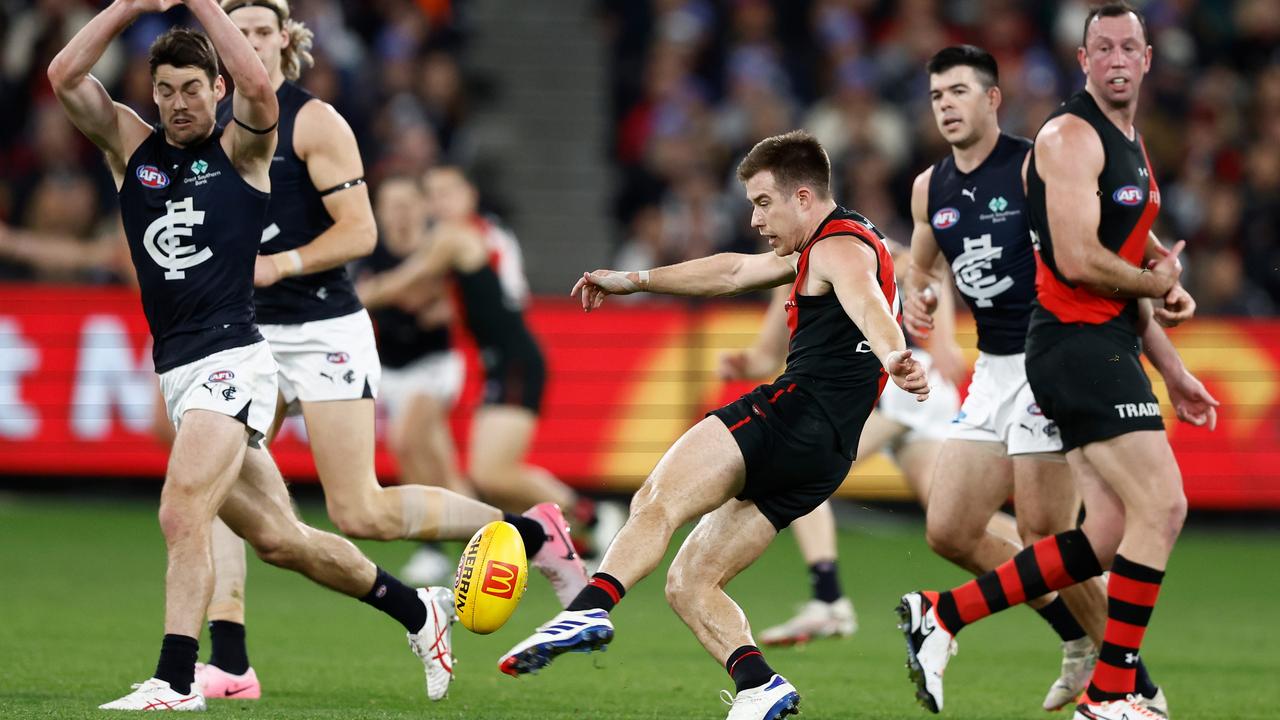 Zach Merrett launches the Bombers forward. Picture: Michael Willson/AFL Photos via Getty Images