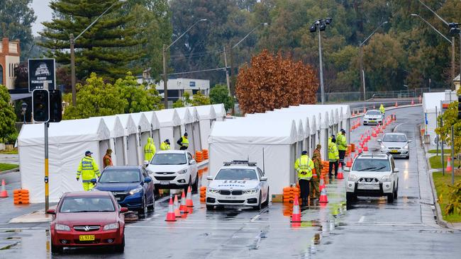 A roadblock set up in Wodonga Place, Albury at the NSW border. Picture: Simon Dallinger