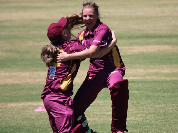 Century-maker Tori Russell (right) embraced by Skye skipper Stacey Dorbolo (left).