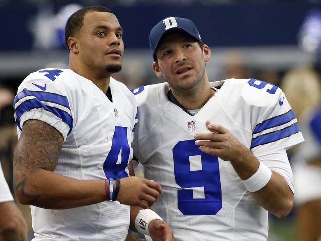 FILE - In a Sunday, Nov. 20, 2016 file photo, Dallas Cowboys' Dak Prescott (4) and Tony Romo (9) talk on the sideline in the first half of an NFL football game against the Baltimore Ravens in Arlington, Texas. The Cowboys went on a record-setting run without quarterback Romo, thanks to a pair of star rookies, Dak Prescott and Esekiel Elliott. (AP Photo/Michael Ainsworth, File)