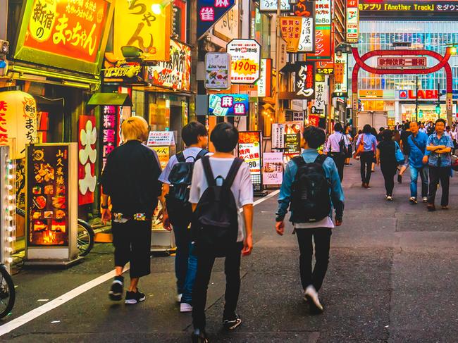 Kabukicho pass illuminated at night in Shinjuku district, Tokyo. The area is a commercial an entertainment zone