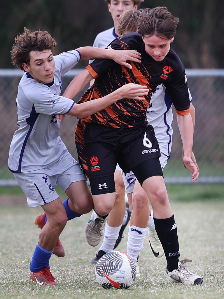 Premier Invitational Football 2024 tournament at Glennon Park Nerang. Field 2...Magic Utd (grey) V Football NT Utd. Picture Glenn Hampson