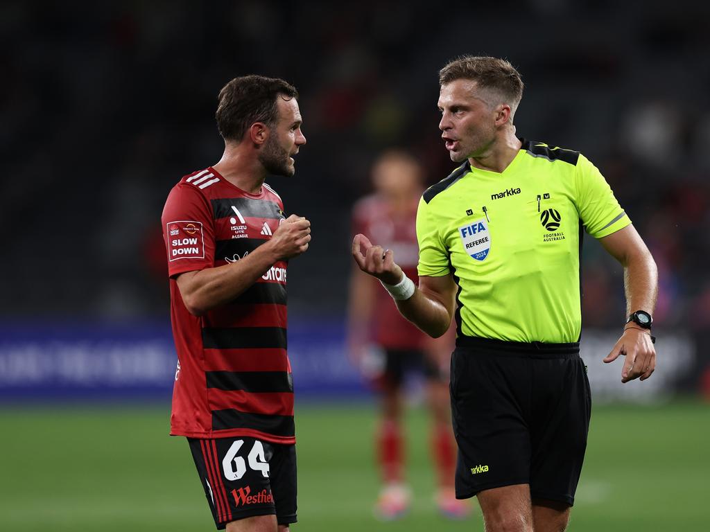 Juan Mata (left) chats with referee Alex King during a Wanderers game this season against Adelaide United. Picture: Cameron Spencer/Getty Images