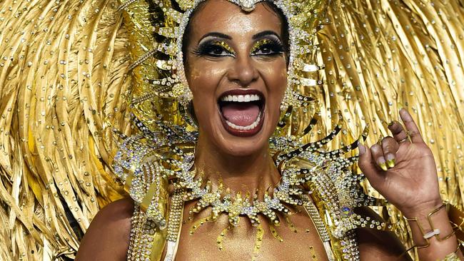 TOPSHOTS Revelers of the Aguia de Ouro samba school perform during the first night of carnival parade at the Anhembi Sambadrome in Sao Paulo, Brazil on February 13, 2015. AFP PHOTO / NELSON ALMEIDA