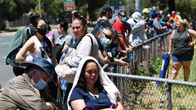 People queue at the Parafield Gardens COVID-19 testing centre in Adelaide on Wednesday. Picture: Getty Images