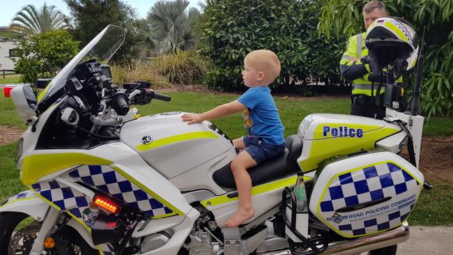 Hamilton Gregory takes a turn on a police bike during his third birthday party.