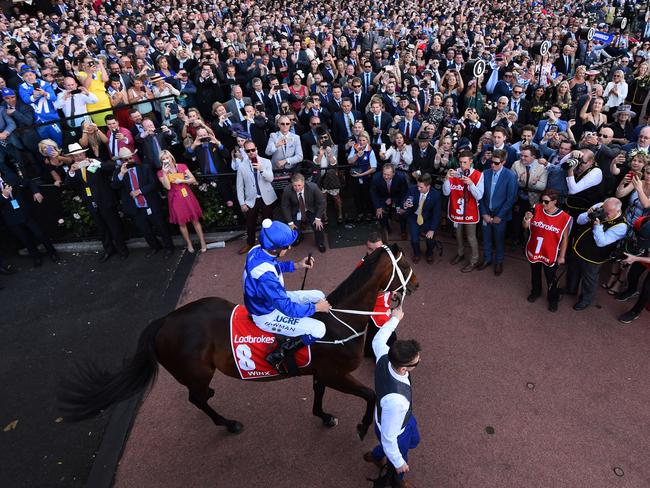 Hugh Bowman and Winx walks walk out to the crowd on Cox Plate day 2017. Picture: Getty