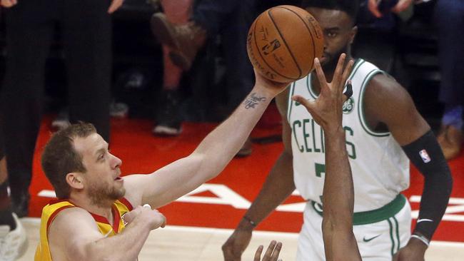 Utah Jazz forward Joe Ingles (2) goes to the basket as Boston Celtics center Al Horford (42) defends in the first half during an NBA basketball game Friday Nov. 9, 2018, in Salt Lake City. (AP Photo/Rick Bowmer)