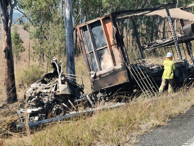 The charred remains of a semi trailer from which the driver was pulled to safety as it burned following a two truck crash on the Bruce Highway, 37km south of Miriam Vale, on August 5. Picture: Rodney Stevens