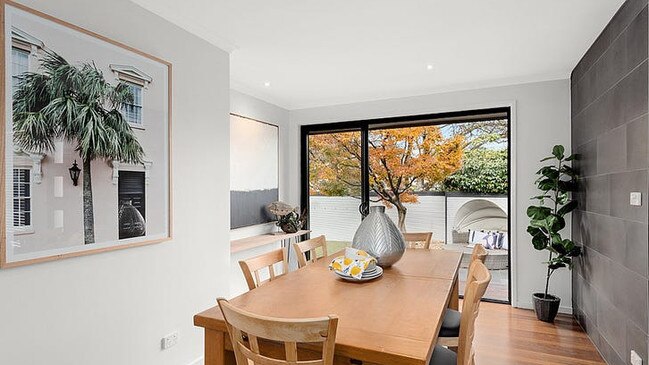 The home has bluestone pavers, stylish solid timber floors and stone benchtops.