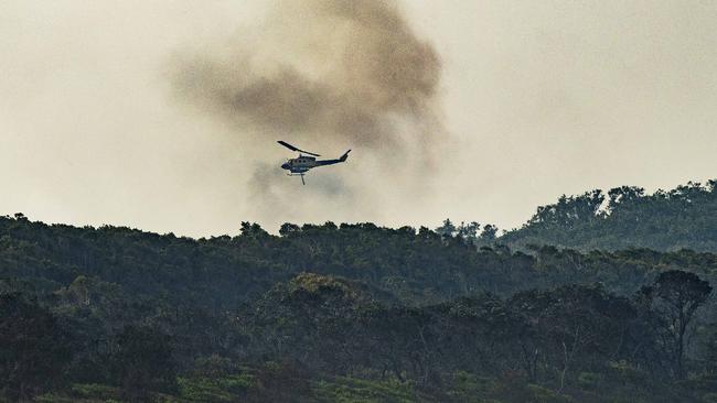 Water bombing helicopter fighting the fire on Noosa North Shore