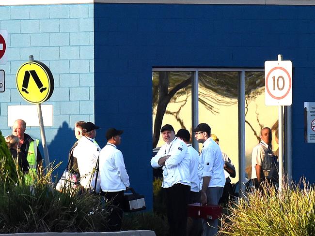 Staff wait outside the prison. Picture: Nicole Garmston