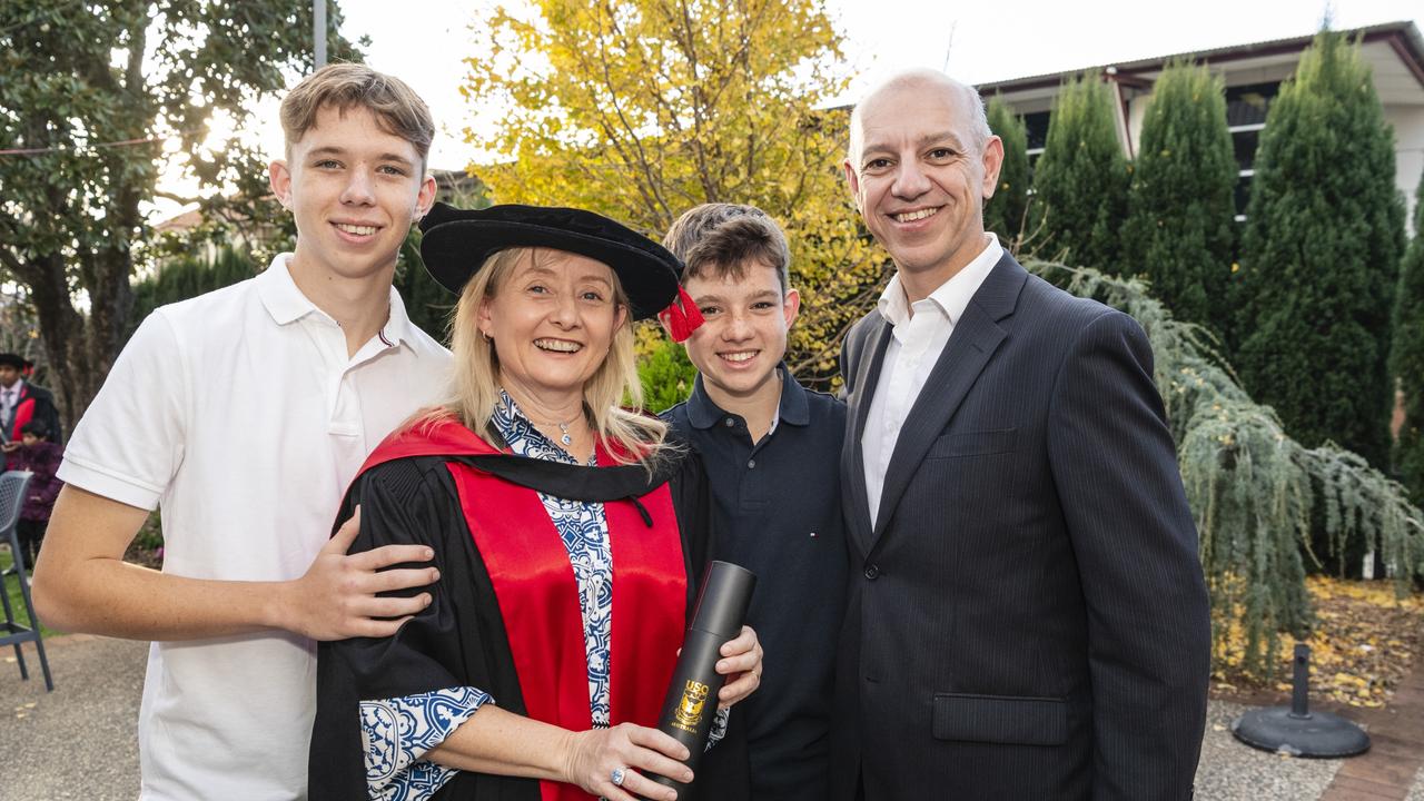 Doctor of Philosophy graduate Catherine Batch-Hennessy with family (from left) Connor, Ciaran and Sylvester Hennessy at a UniSQ graduation ceremony at Empire Theatres, Wednesday, June 28, 2023. Picture: Kevin Farmer