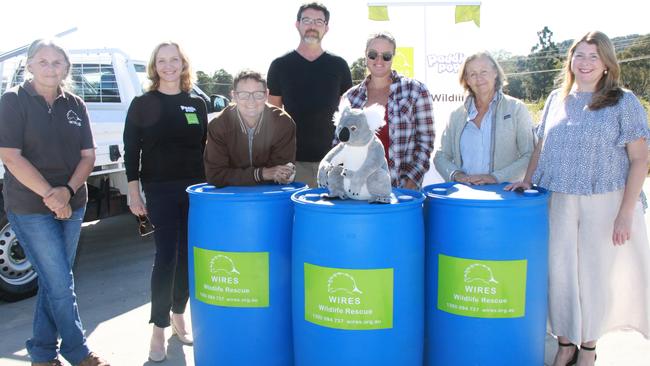 WATER FOR WILDLIFE: Landowners on the Northern Rivers will receive 10 per cent of 800 200L TREE TROFFÂ® arboreal water drinkers which are being distributed free of charge for installation on their properties. L-R WIRES NSW Koala Coordinator Vickii Lett, Cathy and WIRES fundraiser Cathy Sowden, landowners, Ali Treanor, Mark Nolde, Hayley Burgess and Lindy Marjan and WIRES chief officer Kyla Shelley celebrate the launch of the project at Toyota Lismore who are supporting the initiative. Photo: Alison Paterson