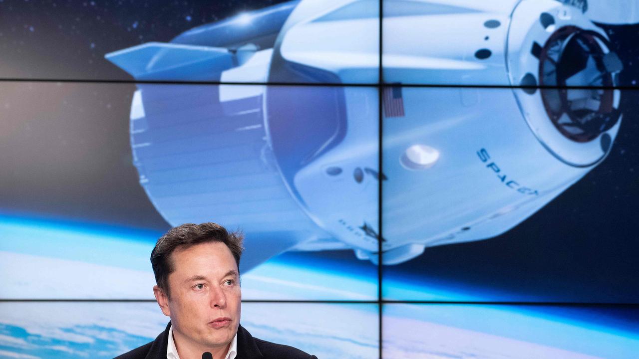 SpaceX chief Elon Musk speaks during a press conference in March 2019 after the launch of SpaceX Crew Dragon Demo mission at the Kennedy Space Center in Florida, US. Behind him is the Crew Dragon capsule. Picture: AFP