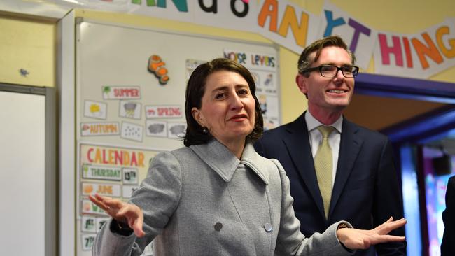 NSW Premier Gladys Berejiklian and Treasurer Dominic Perrottet meet students at Kent Road Public School in Sydney yesterday.