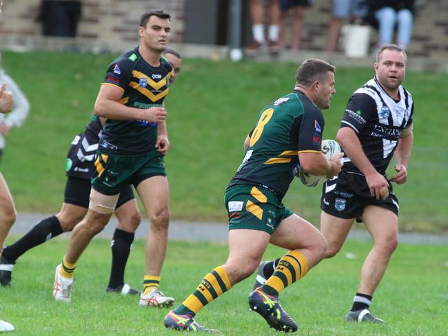 Troy Martin has a run for the Lions. Picture: Warren Gannon Photography