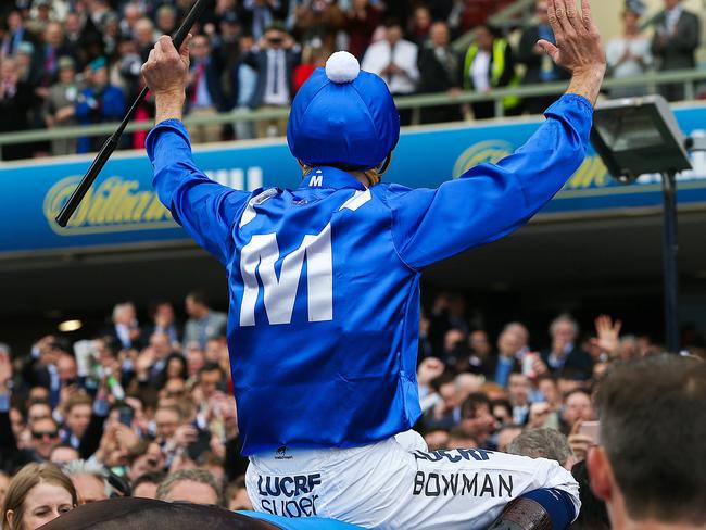 Hugh Bowman acknowledges the crowd as he returns to scale. Picture: Ian Currie