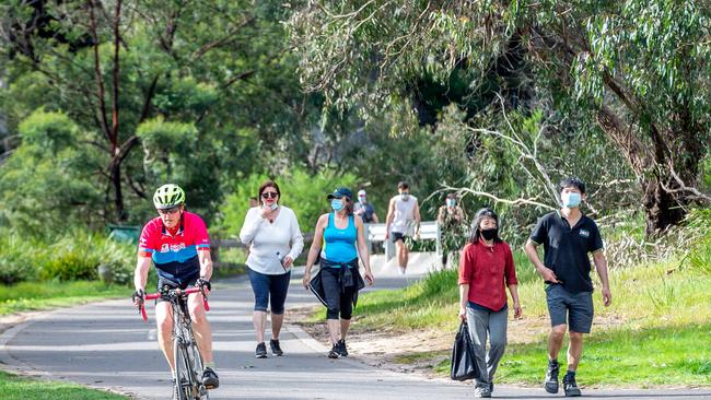 People exercise in Westerfolds Park, Eltham. Picture: Jake Nowakowski