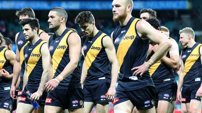 Richmond players walk off after getting thumped by the Sydney Swans. Picture: AAP Image/David Moir