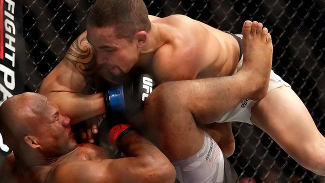 Whittaker crunches Jacare with a solid elbow.