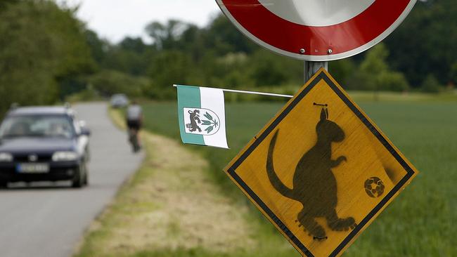 A road sign featuring a kangaroo wearing soccer boots on the road that led to the Socceroos base camp outside Germany’s Ohringen during 2006 FIFA World Cup finals.