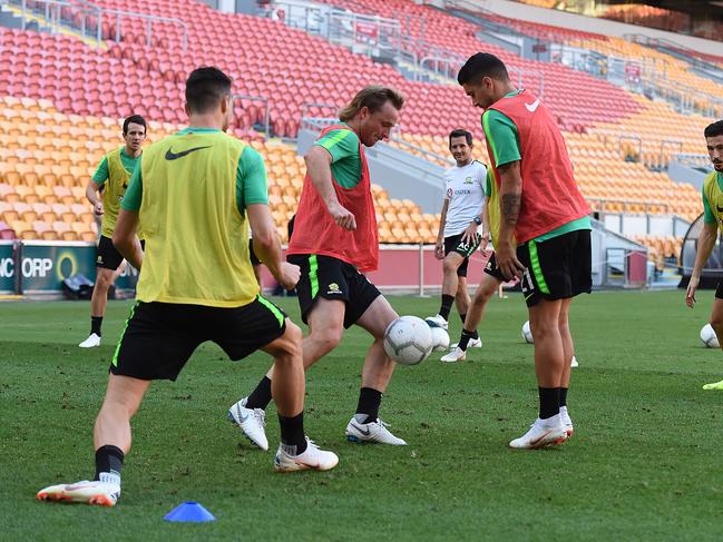 Rhyan Grant (centre) in action during an Australian Socceroos training session at Suncorp Stadium in Brisbane, Friday, November 16, 2018. Australia will play against South Korea in a friendly on Saturday. (AAP Image/Albert Perez) NO ARCHIVING