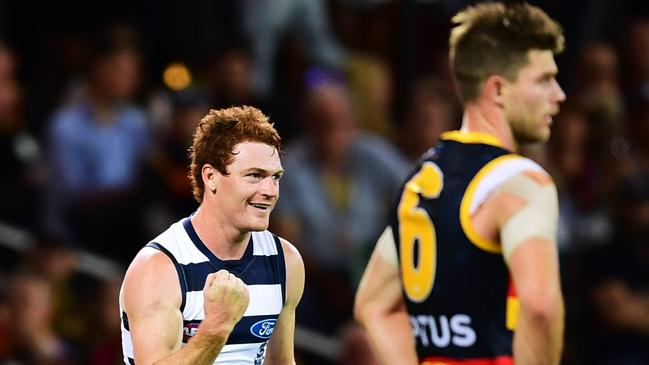 Gary Rohan of the Cats celebrates a goal as Bryce Gibbs watches on. Picture: Mark Brake/Getty Images