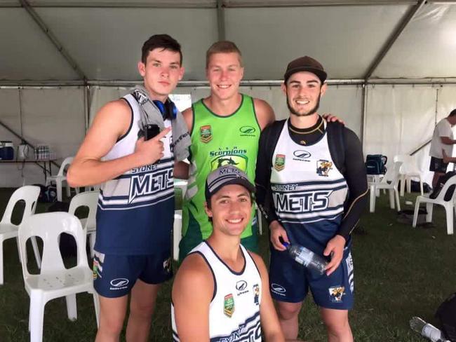 Adam (left) with mates at training.