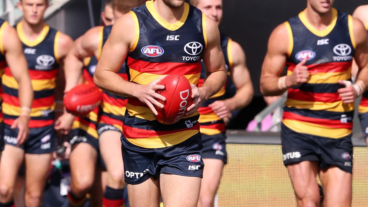 AFL - Sunday, 26th July, 2020 - Adelaide Crows v Essendon at the Adelaide Oval. Crows run out onto the oval - Brodie Smith ( Centre) Picture: Sarah Reed