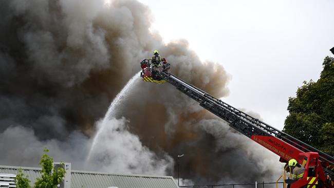 More than 100 firefighters battled the blaze at the Stirling Village shopping centre. Picture: Morgan Sette