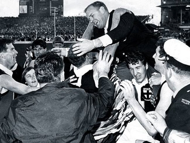 St. Kilda coach Allan Jeans celebrates with his players after their Grand Final win.