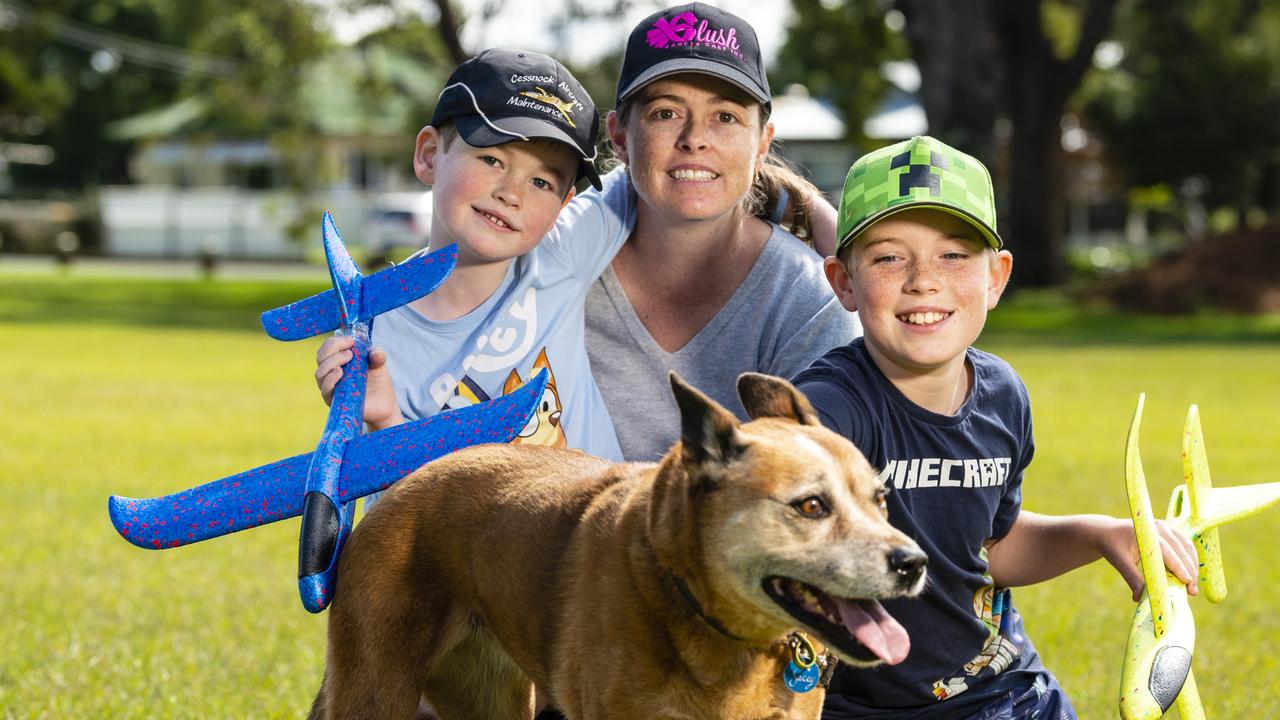 Rebecca Bridge with her sons Bradley (left) and James and their dog Jacey during Mother's Day celebrations in the Queensland State Rose Garden, Newtown Park, Sunday, May 8, 2022. Picture: Kevin Farmer