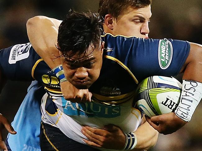 CANBERRA, AUSTRALIA - MAY 29: Ita Vaea of the Brumbies is tackled during the round 16 Super Rugby match between the Brumbies and the Bulls at GIO Stadium on May 29, 2015 in Canberra, Australia. (Photo by Stefan Postles/Getty Images)