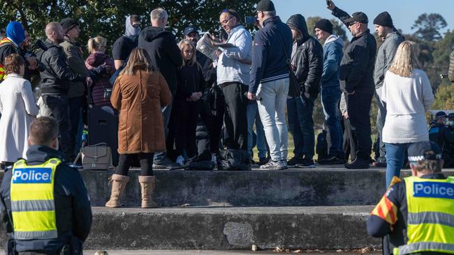 Police surrounded the group, before moving protesters on. Picture: Tony Gough