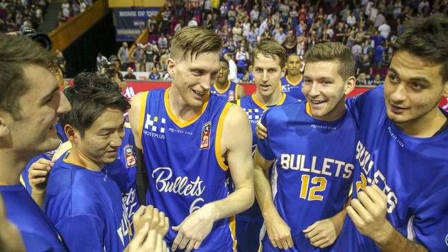 Bullets players celebrate the win. Picture: AAP