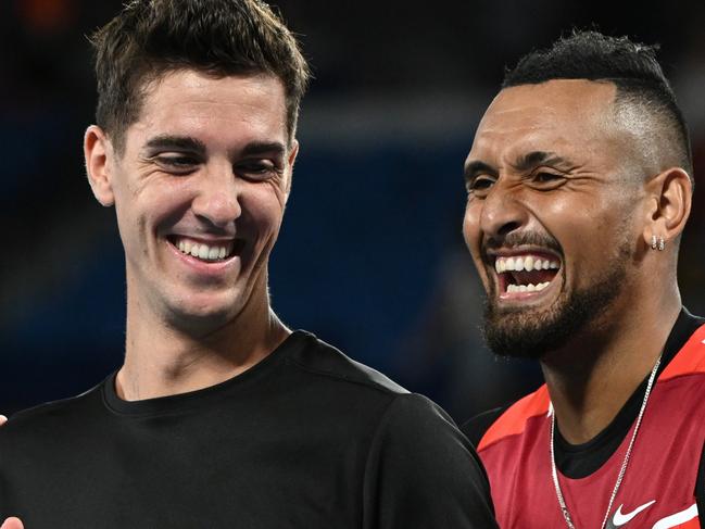 MELBOURNE, AUSTRALIA - JANUARY 29: Thanasi Kokkinakis (L) of Australia and Nick Kyrgios of Australia pose with the championship trophy after winning their Men's DoublesÃÂ Final match against Matthew Ebden of Australia and Max Purcell of Australia during day 13 of the 2022 Australian Open at Melbourne Park on January 29, 2022 in Melbourne, Australia. (Photo by Quinn Rooney/Getty Images)