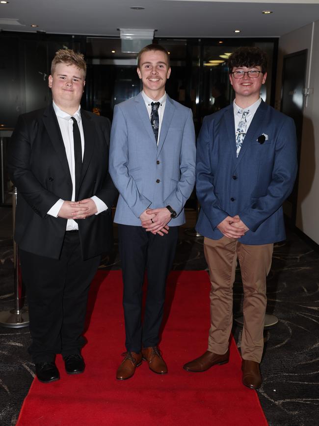 MELBOURNE, AUSTRALIA – JUNE 14 2024 Chris McGregor, Bayley Russell and Noah Diaz attend the Lowanna College Senior Formal 2024 at the Moe Racing Club Picture: Brendan Beckett