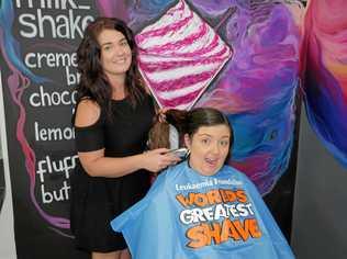 BUZZED: The Hair Hub Cafe manager Danielle Rosin practices her skills on hairdresser Maeghan Cornish. Picture: Eden Boyd