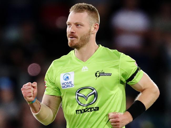 CANBERRA, AUSTRALIA - DECEMBER 14: Nathan McAndrew of the Thunder celebrates after claiming the wicket of Tom Cooper of the Heat during the Big Bash League match between the Sydney Thunder and the Brisbane Heat at Manuka Oval, on December 14, 2020, in Canberra, Australia. (Photo by Brendon Thorne/Getty Images)