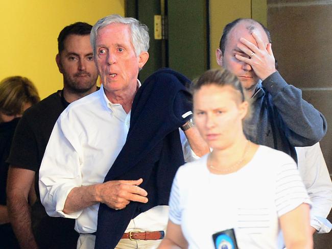 Sandy Dawson Snr, father of Katrina Dawson and former CEO of Arnotts, leaves RPA Hospital this morning. On the right is Katrina’s husband. Picture: Jeremy Piper