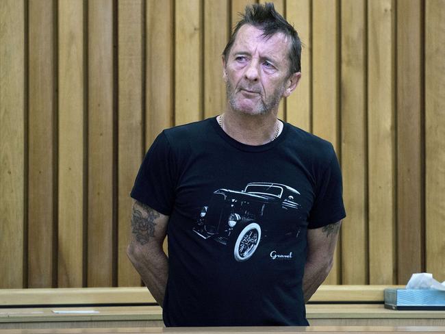 Wants job back at AC/DC ... The former rock band’s drummer Phil Rudd pictured in the dock at the High Court in Tauranga. New Zealand. Picture: AFP / Marty Melville