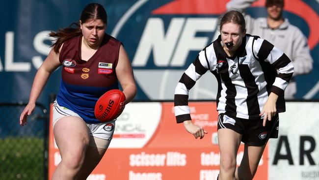 Banyule’s Chloe Sheehan and Chloe Robinson of Montmorency have eyes for the ball. Picture: Hamish Blair