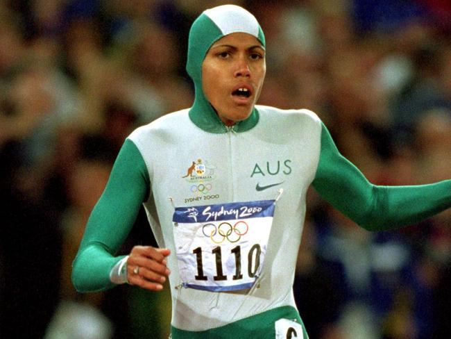 25 Sep 2000:  Cathy Freeman of Australia crosses the line to win gold in the Womens 400m Final at the Olympic Stadium on Day 10 of the Sydney 2000 Olympic Games in Sydney, Australia.  \\ Mandatory Credit: Mike Powell /Allsport