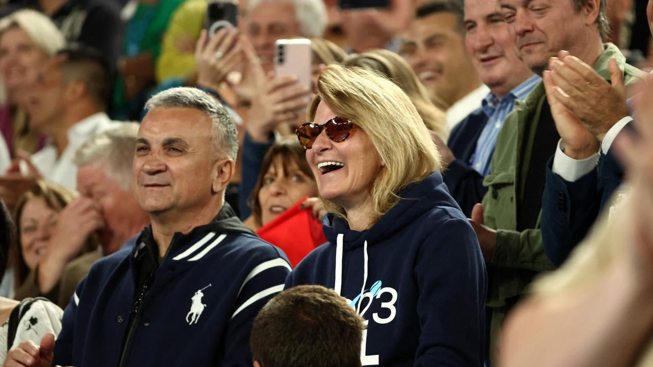 The parents of Serbia's Novak Djokovic, father Srdjan Djokovic (L) and mother Dijana Djokovic watching his quarter-final win.