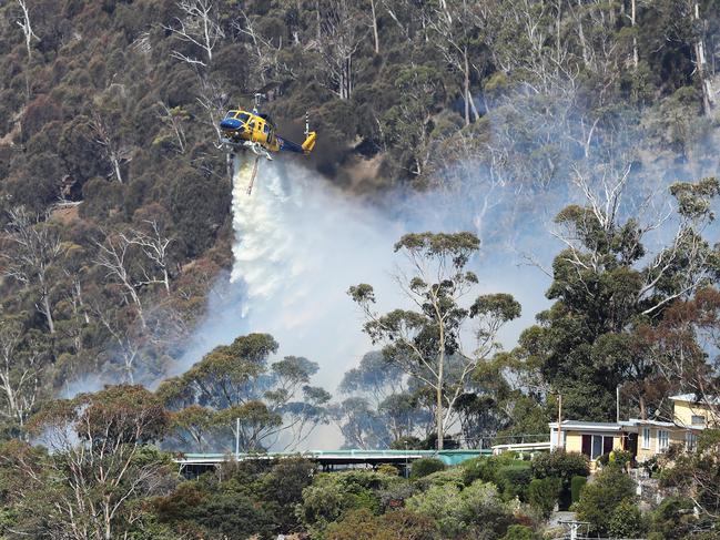 Water bombing operations on Collinsvale Rd, Glenlusk. Picture: NIKKI DAVIS-JONES