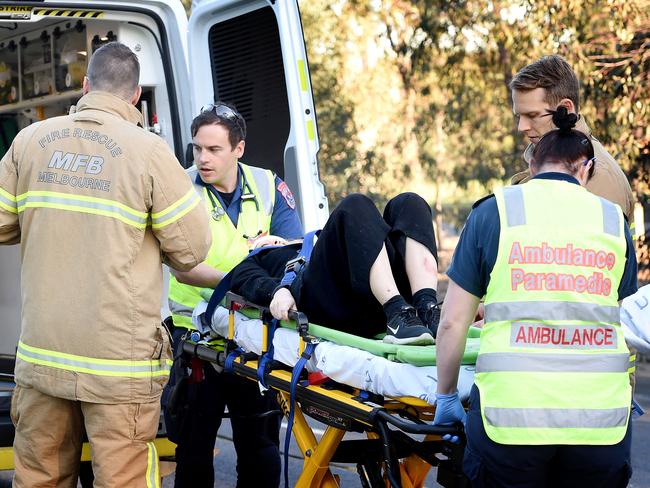 An injured passenger is loaded into an ambulance. Picture: Nicole Garmston