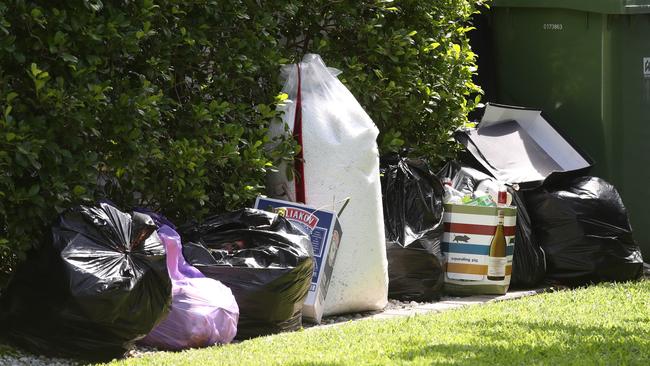 Bags of rubbish outside the house tell the story of a wild weekend. Picture: Glenn Hampson.