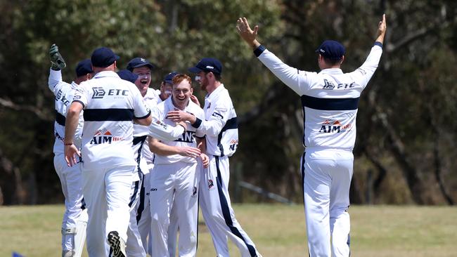 Lachlan Mulgrew celebrates his second wicket with his teammates. Picture: Alan Barber