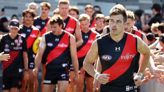 New Essendon skipper Zach Merrett leads the team out for the first time. Picture: Michael Klein